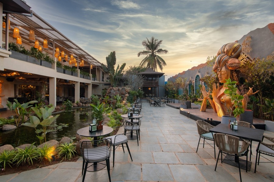 Sunset over the courtyard pathway and goddess statue